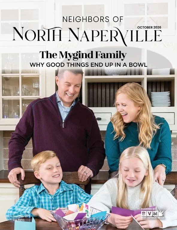 Magazine cover: two parents and two kids laughing around a kitchen table, masthead above them.