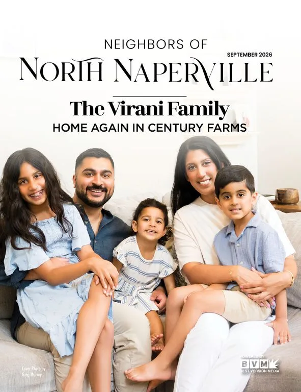 Magazine cover: a family of five sitting close together on a living room sofa, masthead above them.